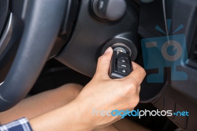 Women Driver Hand Inserting Car Key And Starting Engine Stock Photo