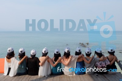 Women Friends Sit Hug Together Look Holiday Sea Sky Stock Photo