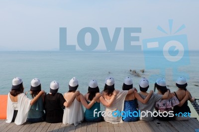 Women Friends Sit Hug Together Look Love Blue Sea Sky Stock Photo