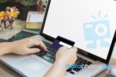 Women Hands Hold Credit Or Debit Card (atm) And Notebook Or Laptop On Work Table Stock Photo