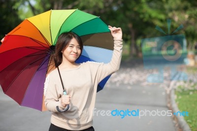 Women Holding Umbrella Stock Photo