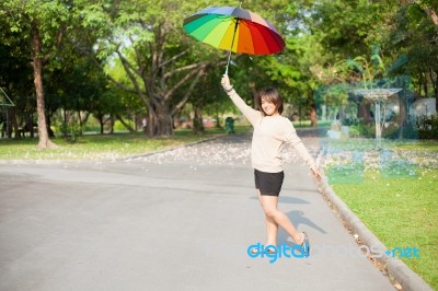 Women Holding Umbrella Stock Photo