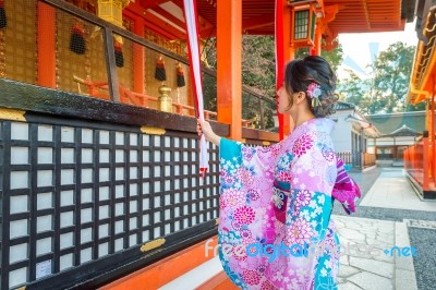 Women In Traditional Japanese Kimonos At Fushimi Inari Shrine In Kyoto, Japan Stock Photo