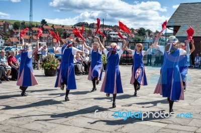 Women Morris Dancing In Whitby North Yorkshire Stock Photo