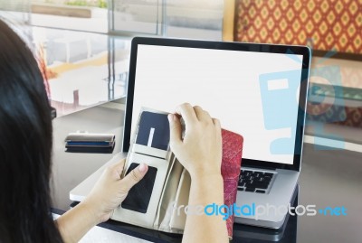 Women Or Girl Hands Pull Credit Or Debit Card (atm) And Blank Notebook Or Laptop Computer Screen Stock Photo