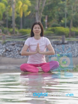 Women Practices Yoga Stock Photo