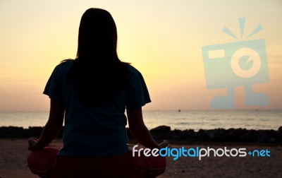 Women Practices Yoga Stock Photo