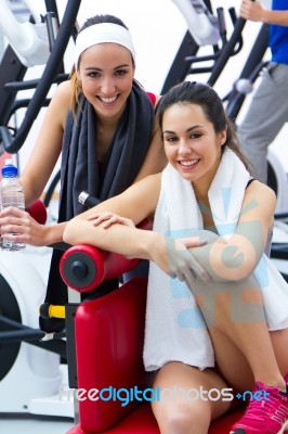 Women Relaxing In The Gym After Making Exercise Stock Photo