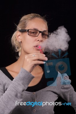 Women Smoking Electric Cigarettes Stock Photo