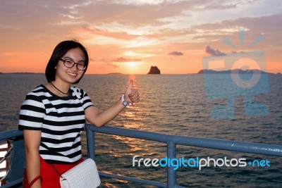 Women Tourist Cruising At Sunset Stock Photo