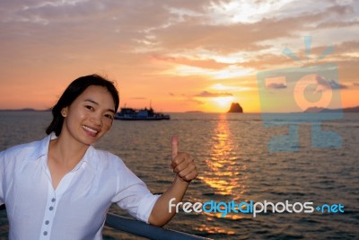 Women Tourist Cruising At Sunset Stock Photo