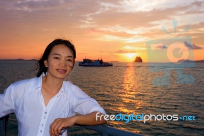 Women Tourist Cruising At Sunset Stock Photo