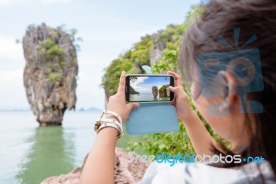 Women Tourist Shooting Natural View By Mobile Phone Stock Photo