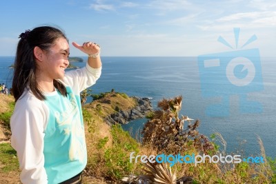 Women Tourists Looking At Beautiful Nature Sea Stock Photo