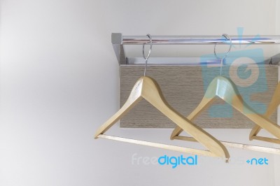 Wood Cloth Hanger On Metal Rail And Wood Panel Stock Photo