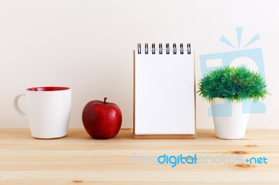 Wood Desk With Notepad And White Mug Stock Photo