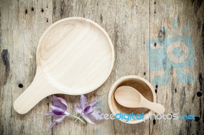 Wood Dish On The Wooden Background. Top View Stock Photo