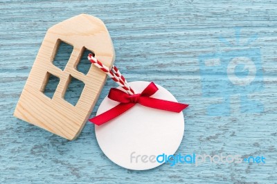 Wood House With Blank Paper Tag Stock Photo