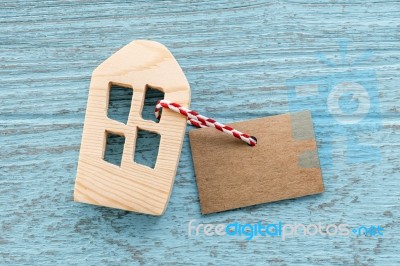 Wood House With Blank Paper Tag Stock Photo