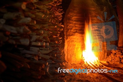 Wood Is Being Burned For Making Charcoal<br />\r Stock Photo