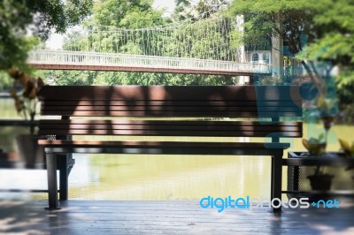 Wooden Bench In A Water House Garden Stock Photo