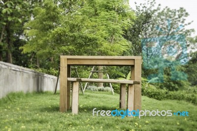 Wooden Bench In Outdoors Garden In Summer Stock Photo