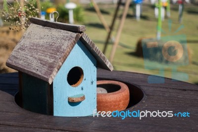 Wooden Bird House Decorated On The Table Stock Photo