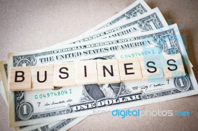 Wooden Block Word Business And Dollar Banknote Stock Photo