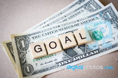 Wooden Block Word Goal And Dollar Banknote Stock Photo