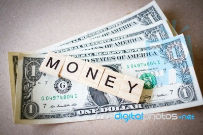 Wooden Block Word Money And Dollar Banknote Stock Photo