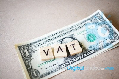 Wooden Block Word Vat And Dollar Banknote Stock Photo