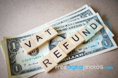 Wooden Block Word Vat Refund And Dollar Banknote Stock Photo