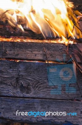 Wooden Board And Foliage On Fire Stock Photo