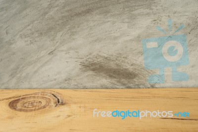 Wooden Board Empty In Front Of Concrete Background Stock Photo