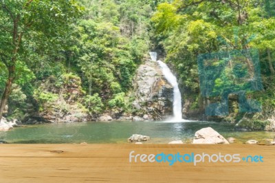 Wooden Board Empty Table In Front Of Blurred Waterfall Backgroun… Stock Photo