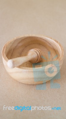 Wooden Bowl And Dipper On Brown Background Stock Photo