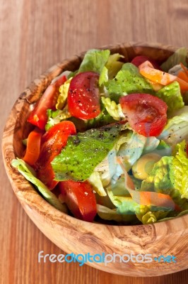 Wooden Bowl With Salad Stock Photo