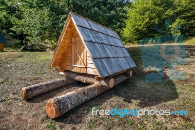 Wooden Cabin In The Woods In Autumn By The Mountain Zelengora, Bosnia And Herzegovina Stock Photo