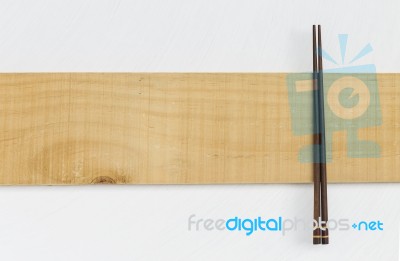 Wooden Chopstick On Wooden Timble Stock Photo