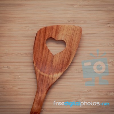 Wooden Cooking Utensils Border. Wooden Spatula With Heart Shape Stock Photo