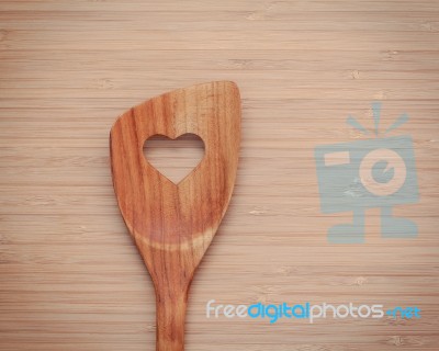 Wooden Cooking Utensils Border. Wooden Spatula With Heart Shape Stock Photo