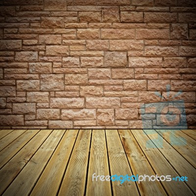 Wooden Deck Floor And Stone Bricks Wall Stock Photo