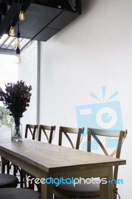 Wooden Dining Table In Coffee Shop Stock Photo