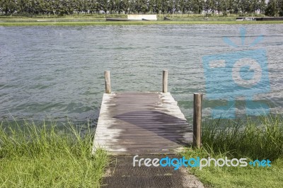 Wooden Dock On Beautiful Forest Lake Stock Photo