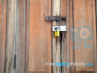 Wooden Door Of Old Barn With Lock And Chain Stock Photo