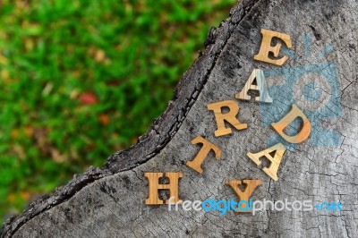 Wooden Earth Day Word On Wood Log Background. Save The Earth Idea Stock Photo