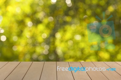 Wooden Floor With Blur Natural Green Bokeh Stock Photo