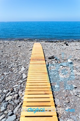 Wooden Footpath On Beach Leading To Portuguese Sea Stock Photo