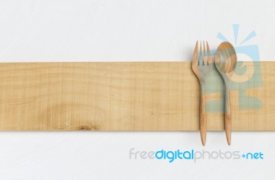 Wooden Fork And Spoon On Wooden Plate Stock Photo