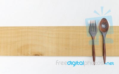 Wooden Fork And Spoon On Wooden Sign Stock Photo